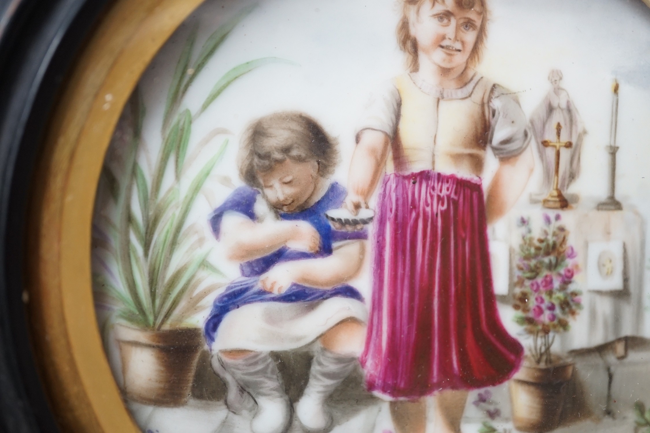 A 19th century Continental porcelain plaque. 16cm diameter overall